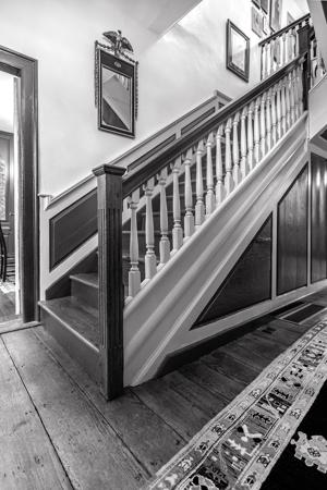 Stairs double loaded at top for independent access to front and 